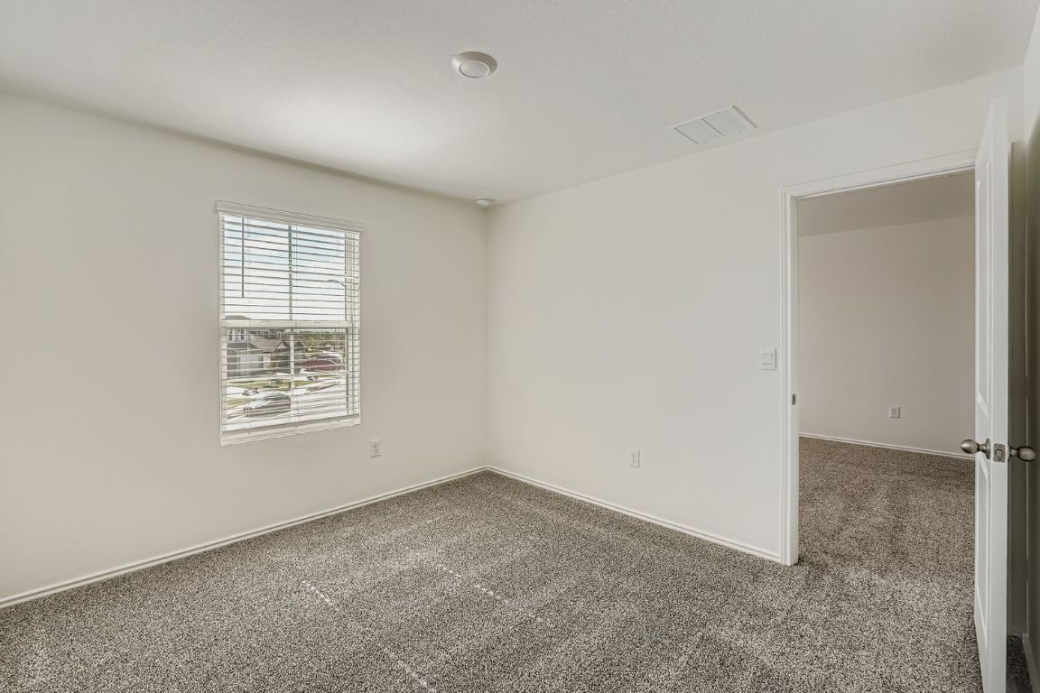 12112 Douglas Fir Circle Mustang Ridge, TX 78610 - Photo 24 of 33 an empty room with a window