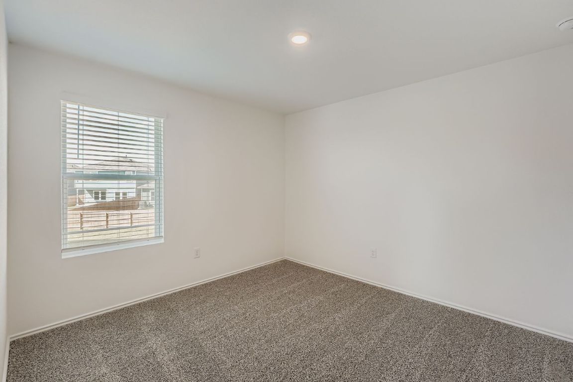 12112 Douglas Fir Circle Mustang Ridge, TX 78610 - Photo 25 of 33 an empty room with a window
