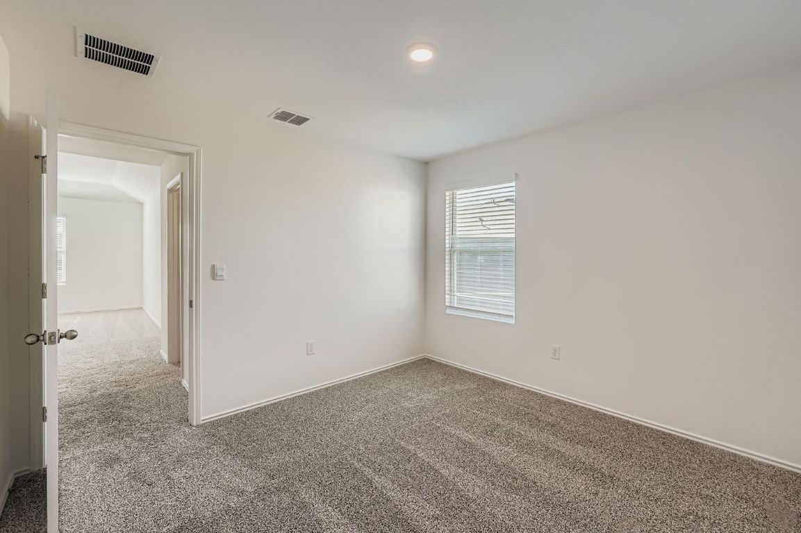 12112 Douglas Fir Circle Mustang Ridge, TX 78610 - Photo 27 of 33 an empty room with a window