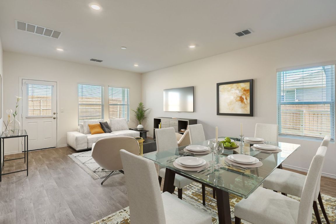 12112 Douglas Fir Circle Mustang Ridge, TX 78610 - Photo 6 of 33 a living room with furniture and wooden floor