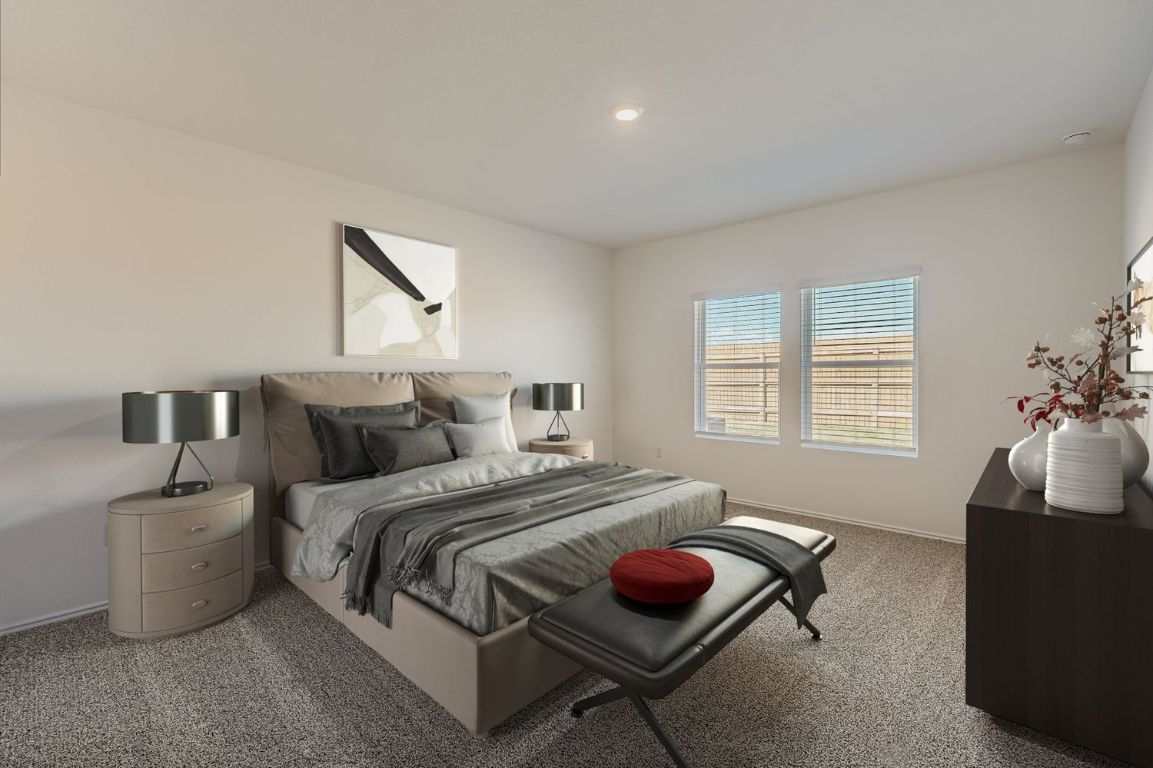 12112 Douglas Fir Circle Mustang Ridge, TX 78610 - Photo 7 of 33 a bedroom with bed and a couch