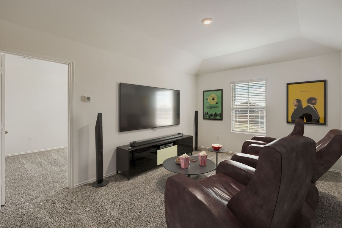 12112 Douglas Fir Circle Mustang Ridge, TX 78610 - Photo 8 of 33 a living room with furniture and a flat screen tv