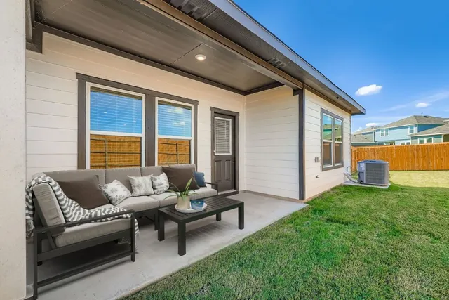 a living room with furniture and a yard