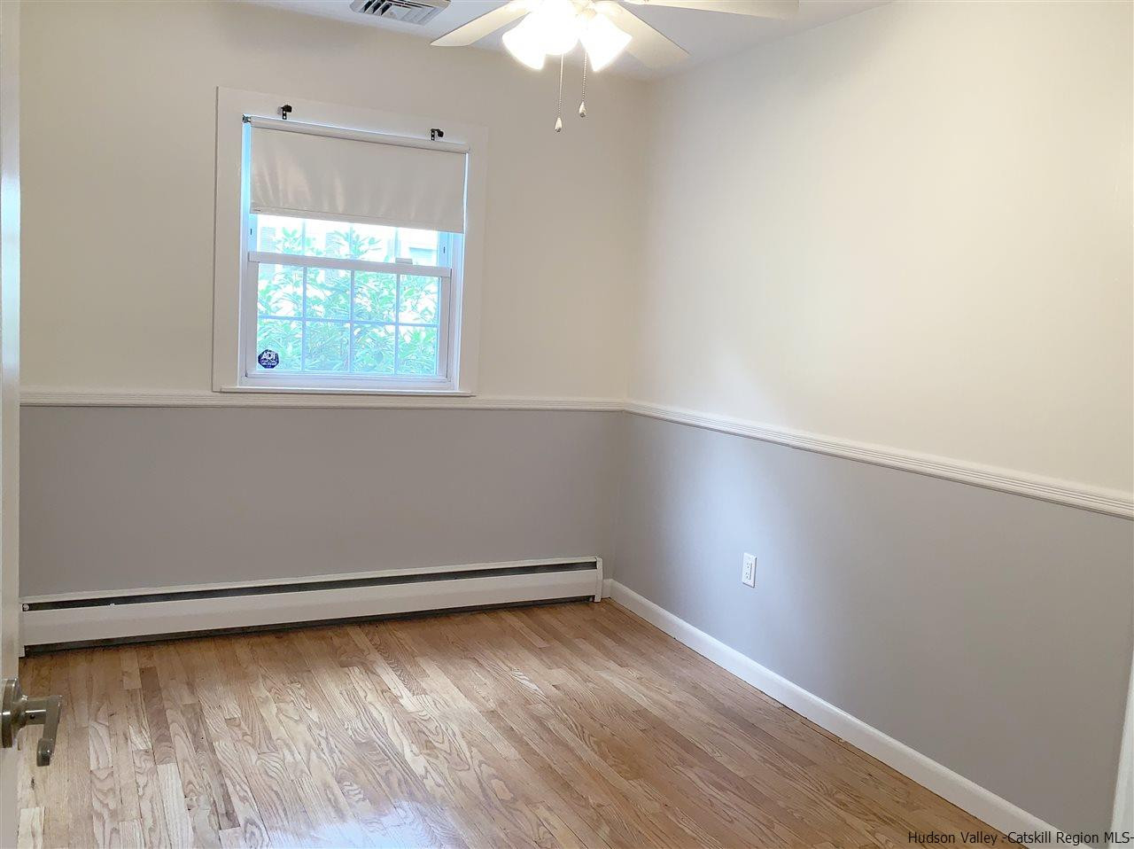 222 Rickey Road Stone Ridge, NY 12484 - Photo 9 of 16 an empty room with a window