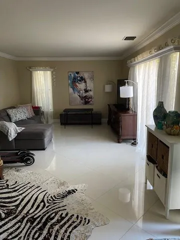 a living room with furniture and a window