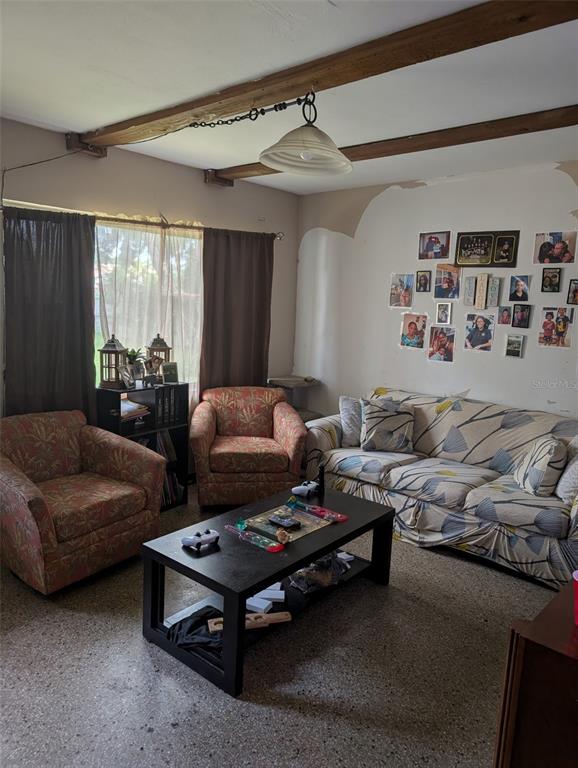 5610 Wilson Road Sanford, FL 32771 - Photo 2 of 10 a bedroom with furniture and a large window