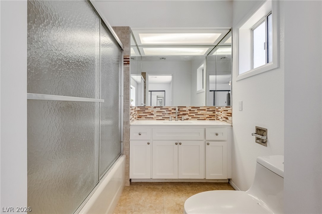 524 Swallow Cove Boulder City, NV 89005 - Photo 21 of 58 A well-appointed bath features a sleek vanity and convenient shower-over-tub combination.