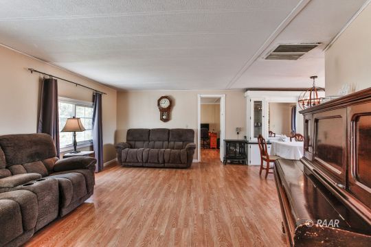 4512 Stark Street Ridgecrest, CA 93555 - Photo 5 of 22 a living room with furniture and a flat screen tv