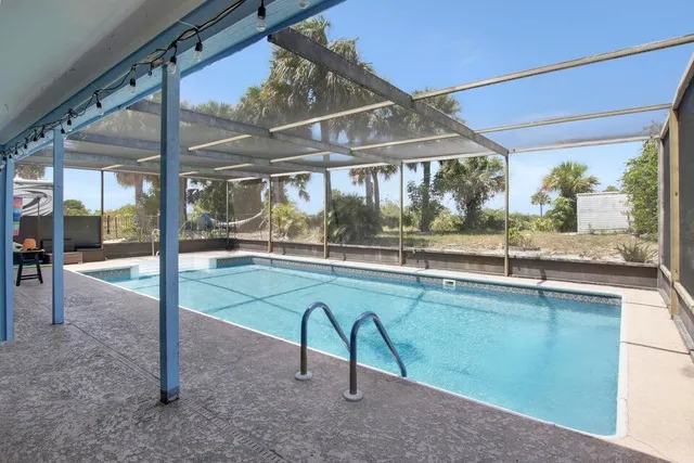 a view of a swimming pool with a porch