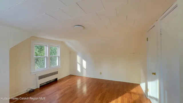 a view of an empty room and window