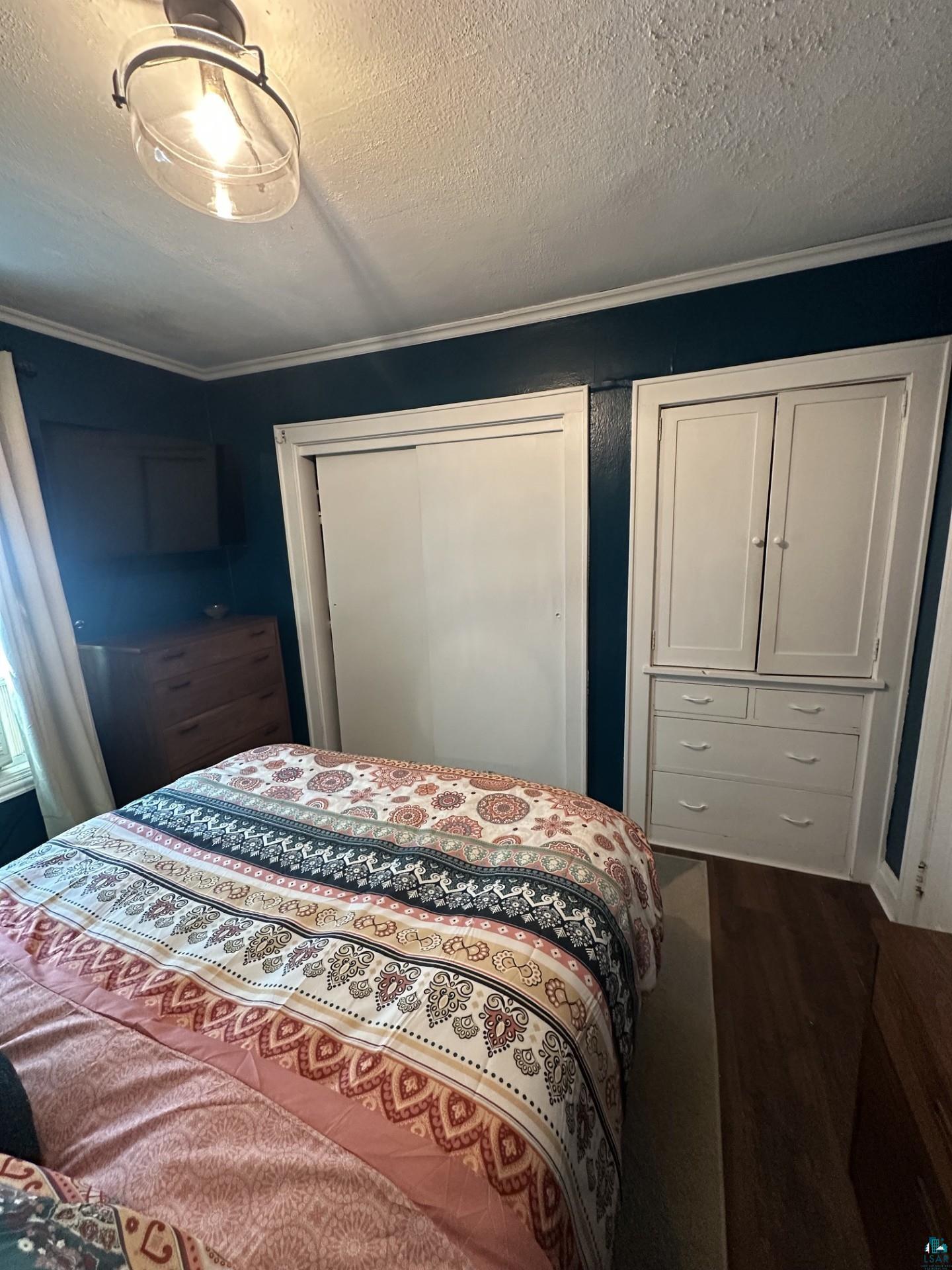 208 Chestnut Street Cloquet, MN 55720 - Photo 18 of 24 Recessed lighting fixture with a clear glass shade, wood-finish flooring, and white trim
