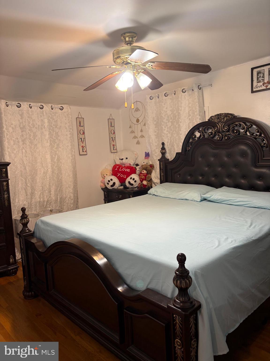 7404 Wyndam Road Pennsauken, NJ 08110 - Photo 21 of 50 a bedroom with a bed and a chandelier