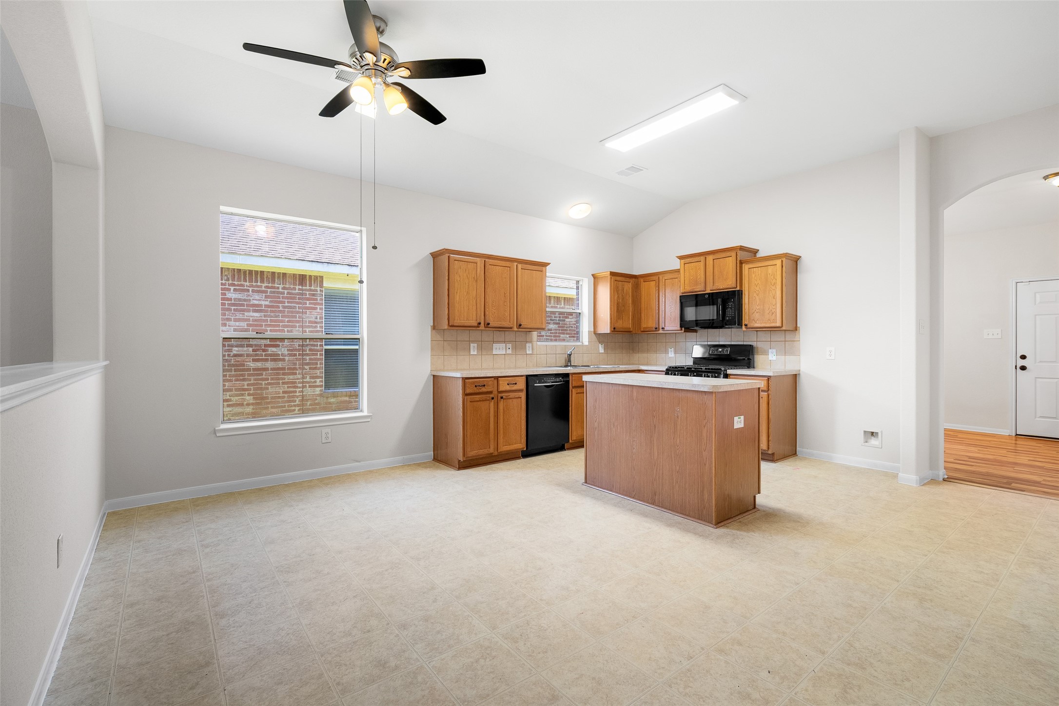 7510 Summer Dale Drive Rosenberg, TX 77469 - Photo 5 of 17 a view of kitchen with stainless steel appliances a window and a fireplace