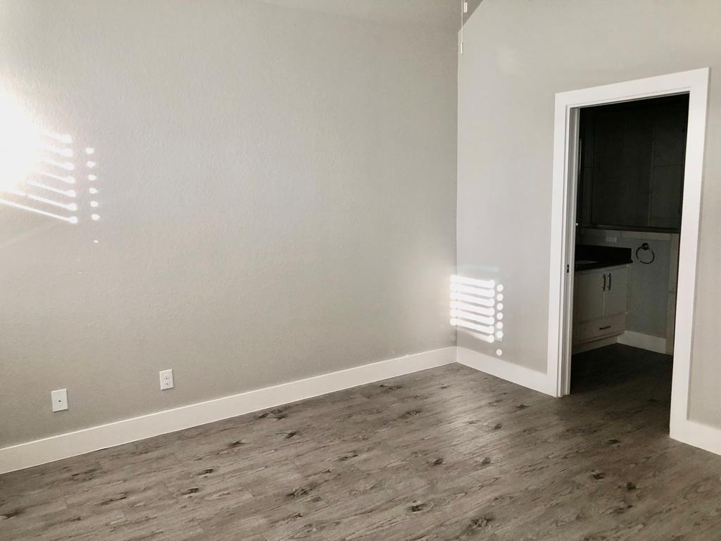 229 Riley Lane Fredericksburg, TX 78624 - Photo 9 of 16 wooden floor in an empty room