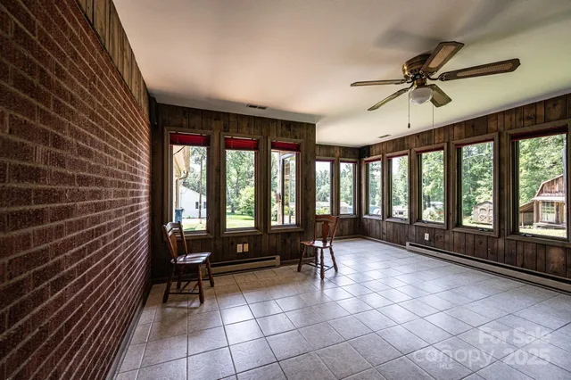 a view of front door with furniture and a window