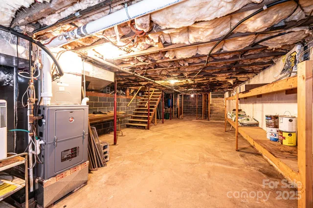 a view of a house with backyard and a patio