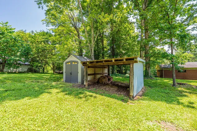 a view of backyard with deck and backyard