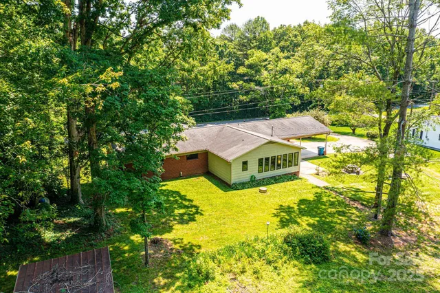 a backyard of a house with lots of green space
