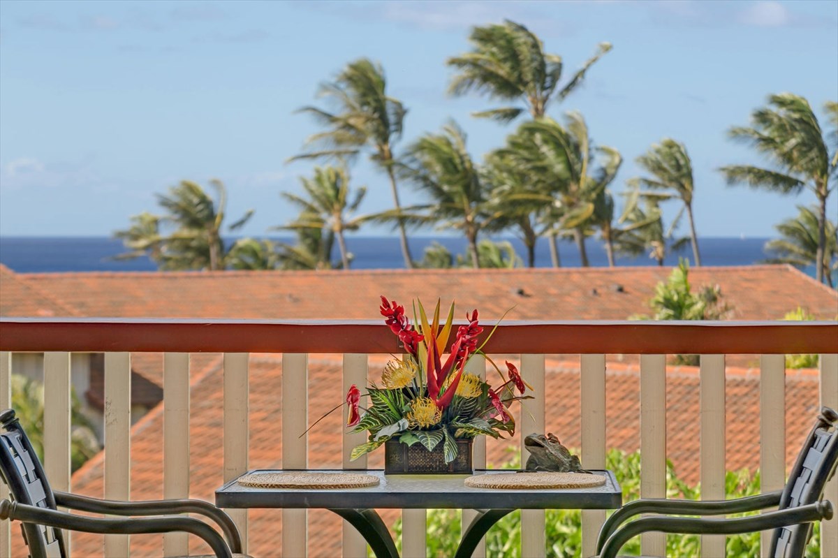 a view of a vase of flowers sitting on a window