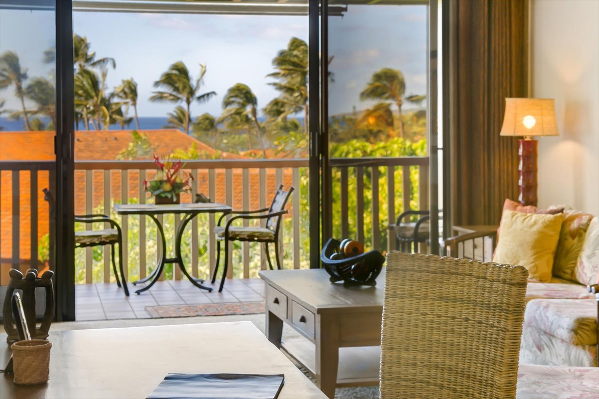 1870 Hoone Road, Unit 802 Koloa, HI 96756 - Photo 14 of 24 a living room with furniture and a floor to ceiling window