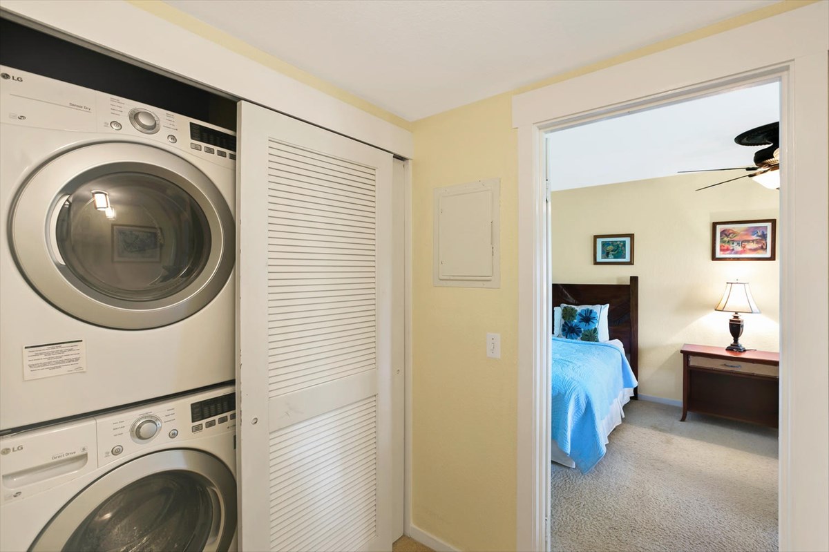 1870 Hoone Road, Unit 802 Koloa, HI 96756 - Photo 21 of 24 a view of a hallway with washer and dryer