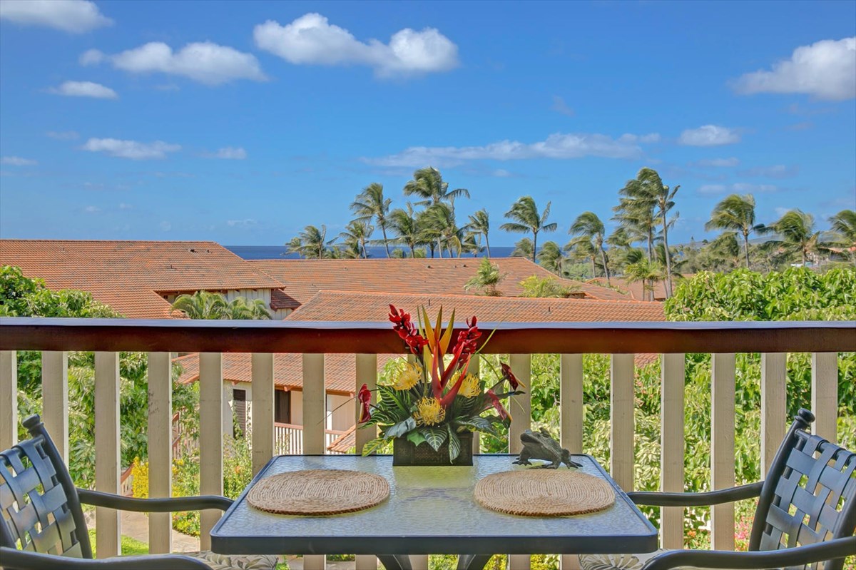 1870 Hoone Road, Unit 802 Koloa, HI 96756 - Photo 23 of 24 a view of a chairs and table in a patio