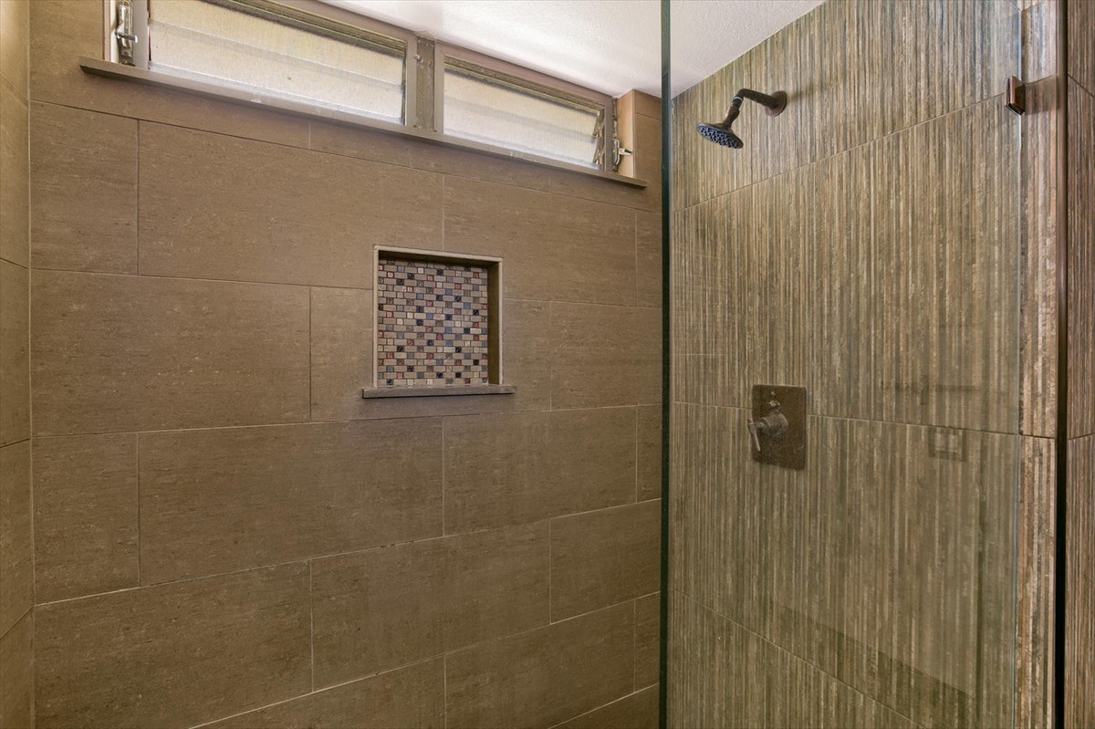 1870 Hoone Road, Unit 802 Koloa, HI 96756 - Photo 4 of 24 a bathroom with a shower and a sink