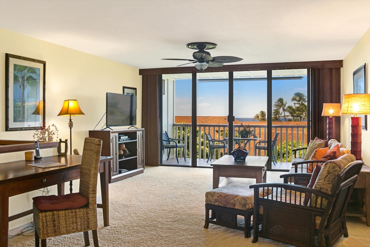 1870 Hoone Road, Unit 802 Koloa, HI 96756 - Photo 7 of 24 a living room with furniture and a floor to ceiling window