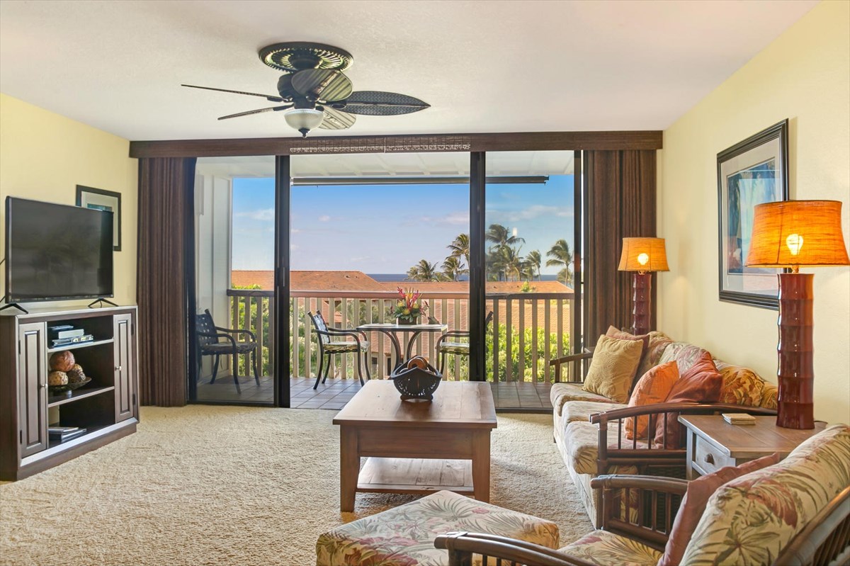 1870 Hoone Road, Unit 802 Koloa, HI 96756 - Photo 10 of 24 a living room with furniture and a flat screen tv