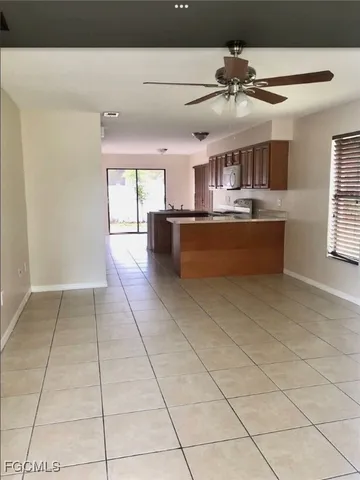 a kitchen with stainless steel appliances a sink stove and cabinets