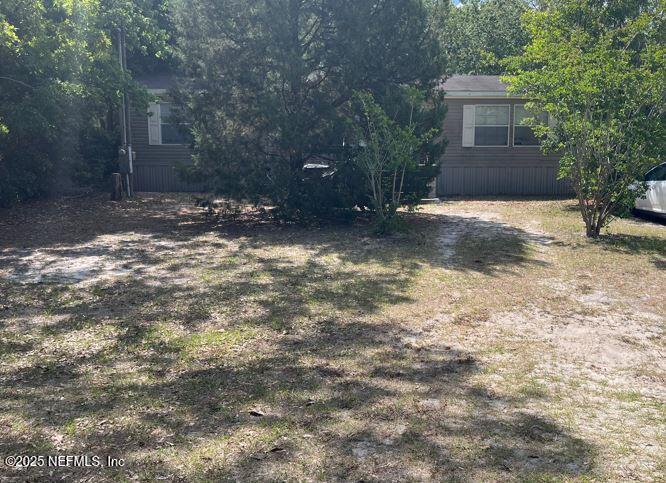 3679 Loango Road Orange Park, FL 32065 - Photo 1 of 1 a view of a house with a yard