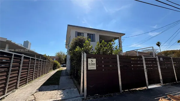 a view of a house with a potted plant