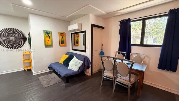 a living room with furniture and a window