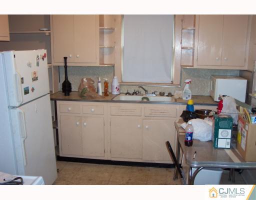 921 King Georges Post Road Edison, NJ 08837 - Photo 4 of 8 a utility room with sink dryer and washer