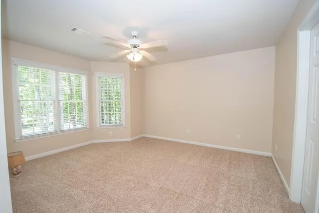 a white toilet sitting next to a bath tub