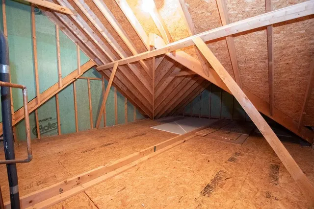 a white bath tub sitting next to a shower