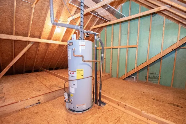 a bedroom with a bed and a mirror