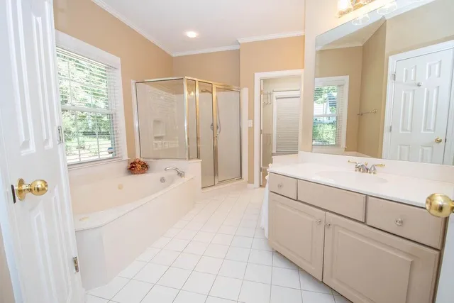 an empty room with a fireplace and window