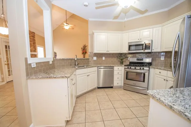 a view of a swimming pool with a yard