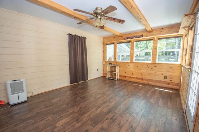 a view of a lake with houses in the back