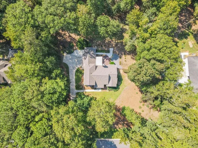 a view of a lake with houses in the back