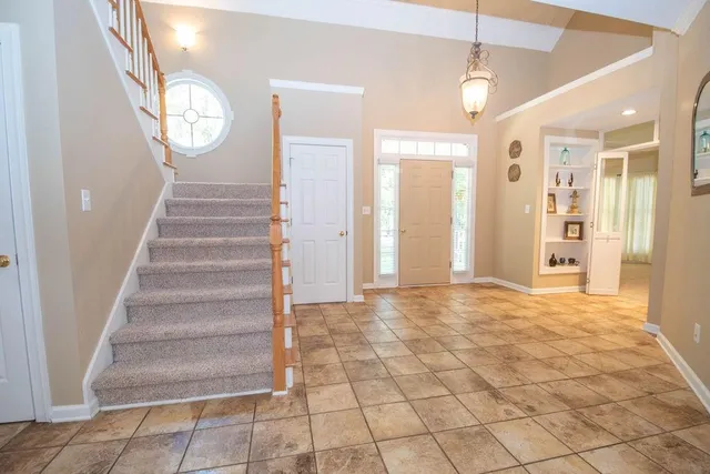 a living room with furniture and a rug