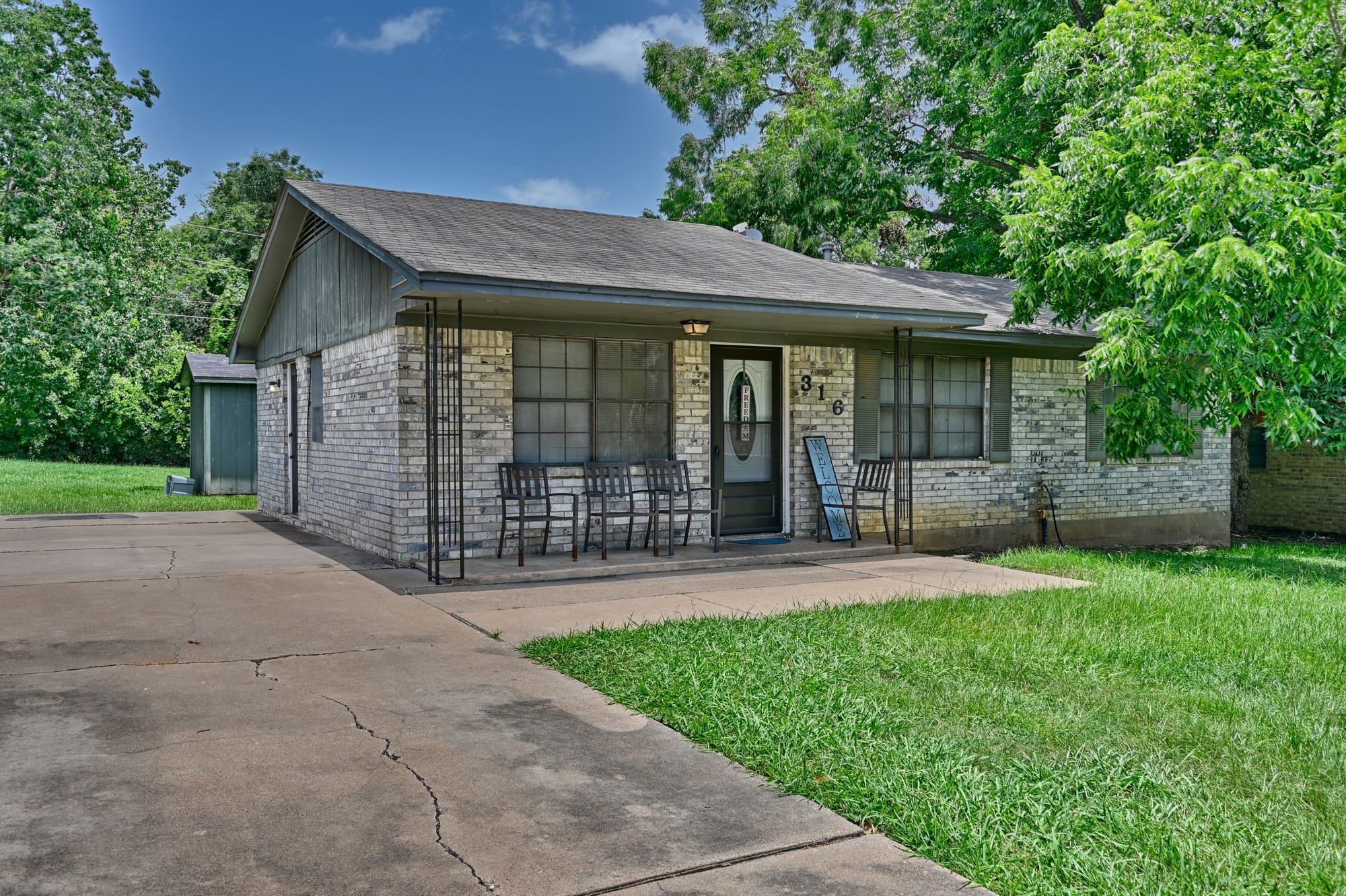 316 Johnson Street Brenham, TX 77833 - Photo 4 of 19 on a private, tree-shaded lot!
