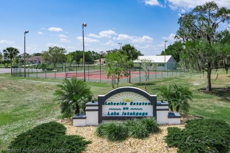 5949 Thunder Road Sebring, FL 33876 - Photo 19 of 25 a view of a park with a sign board and garden