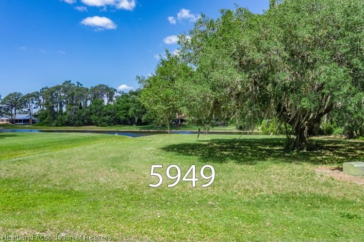 5949 Thunder Road Sebring, FL 33876 - Photo 4 of 25 a view of a park with large trees