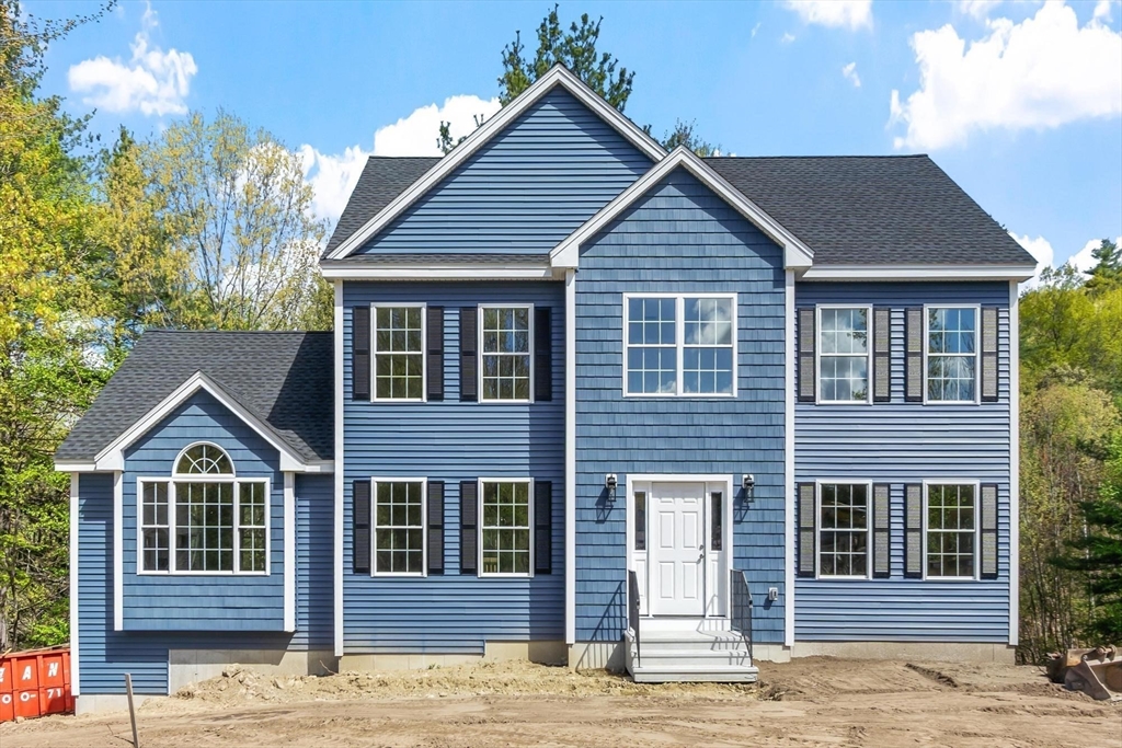 22 Benoit Avenue Pelham, NH 03076 - Photo 2 of 42 a front view of a house with a yard