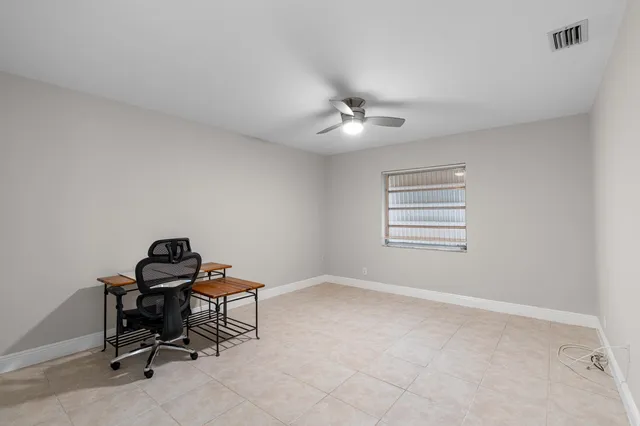 a bathroom with a sink toilet and a mirror