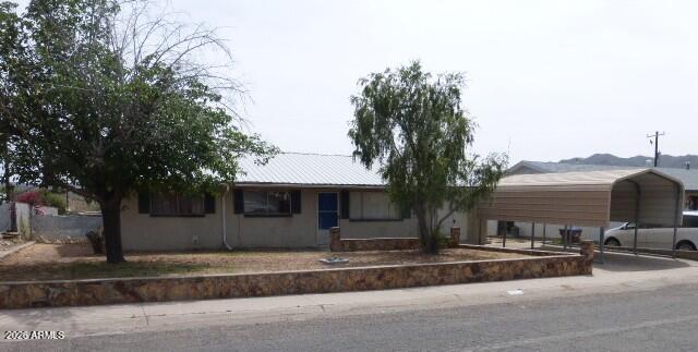 303 Greenwich Road Kearny, AZ 85137 - Photo 2 of 18 a front view of house with yard and trees around