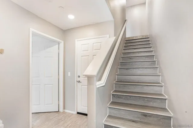 an entryway with wooden floor