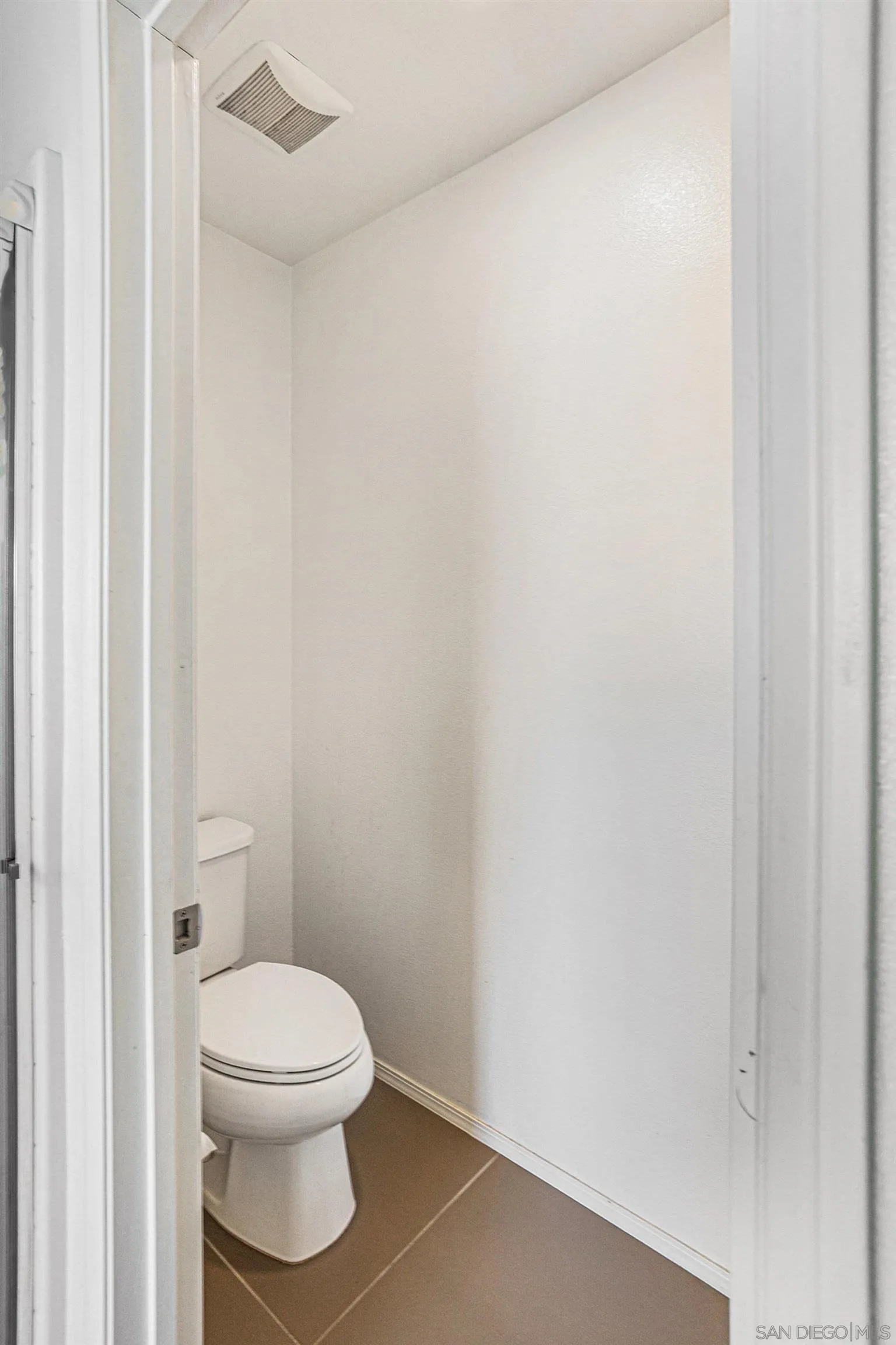 2840 Athens Road, Unit 10 Chula Vista, CA 91915 - Photo 25 of 56 a white toilet sitting next to a white cabinet